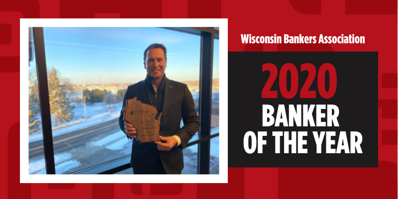 Jim Hegenbarth holds award for winning Wisconsin Bankers Association 2020 Banker of the Year