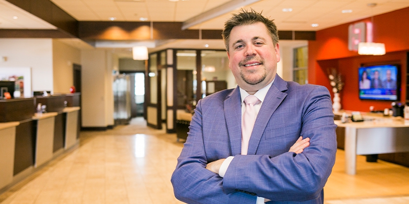 Josh Marron smiling at camera in lobby of Middleton, WI Park Bank branch lobby