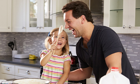 Dad and daughter baking