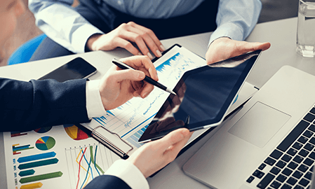 Businessmen working on statistics